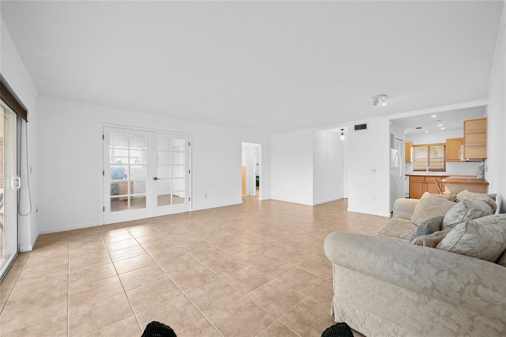 2501 South Ocean Boulevard, Unit 301 Boca Raton, FL 33432 - Photo 19 of 32 a large living room with a large window