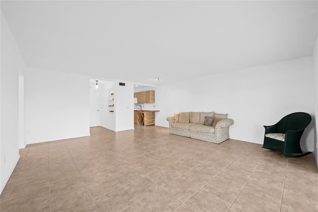 2501 South Ocean Boulevard, Unit 301 Boca Raton, FL 33432 - Photo 20 of 32 a living room with furniture and a couch