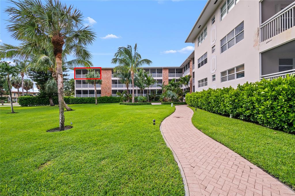 2501 South Ocean Boulevard, Unit 301 Boca Raton, FL 33432 - Photo 4 of 32 a view of a building with a yard