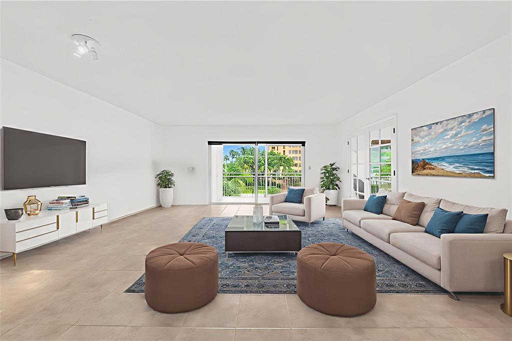 2501 South Ocean Boulevard, Unit 301 Boca Raton, FL 33432 - Photo 5 of 32 a living room with furniture and a flat screen tv