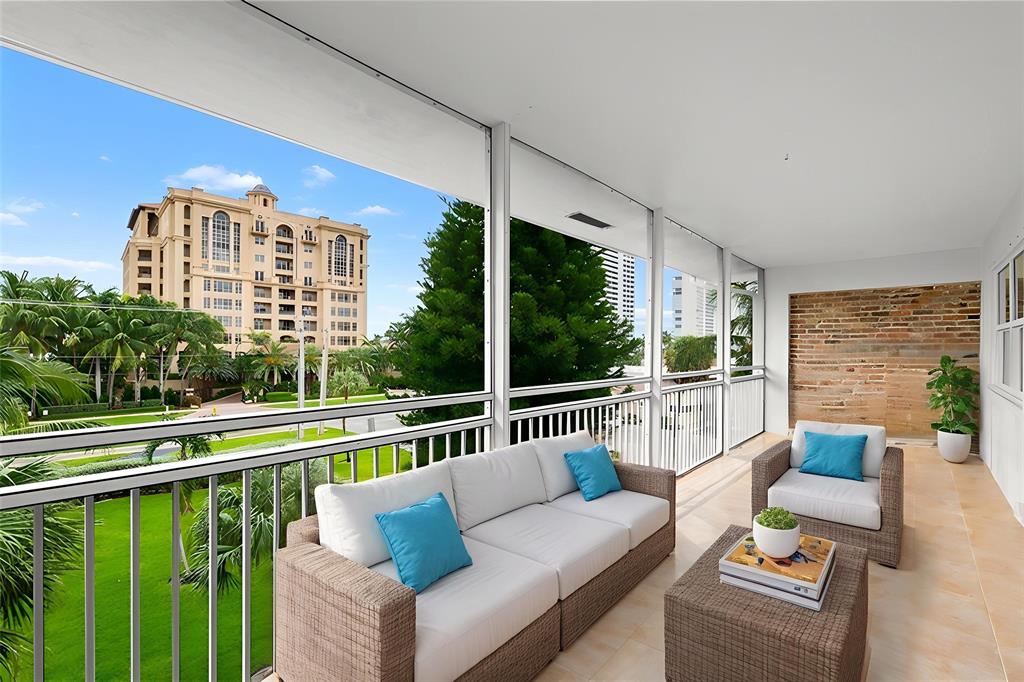 2501 South Ocean Boulevard, Unit 301 Boca Raton, FL 33432 - Photo 7 of 32 a balcony with furniture and a view of lake