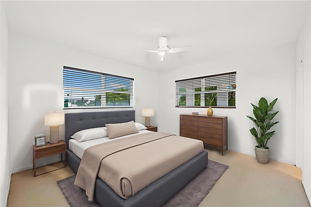 2501 South Ocean Boulevard, Unit 301 Boca Raton, FL 33432 - Photo 8 of 32 a bedroom with a large bed and a potted plant