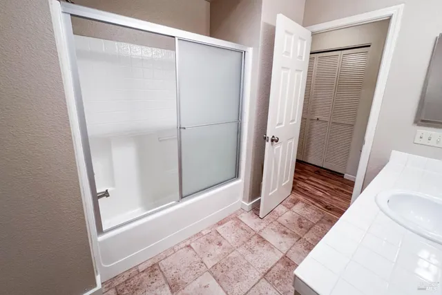 a bathroom with a sink and a mirror