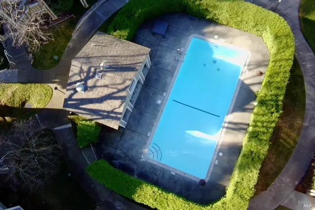 a view of backyard with seating area and green space