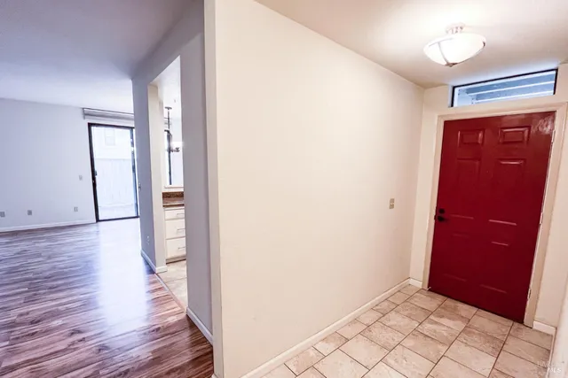 wooden floor in an empty room and a mirror