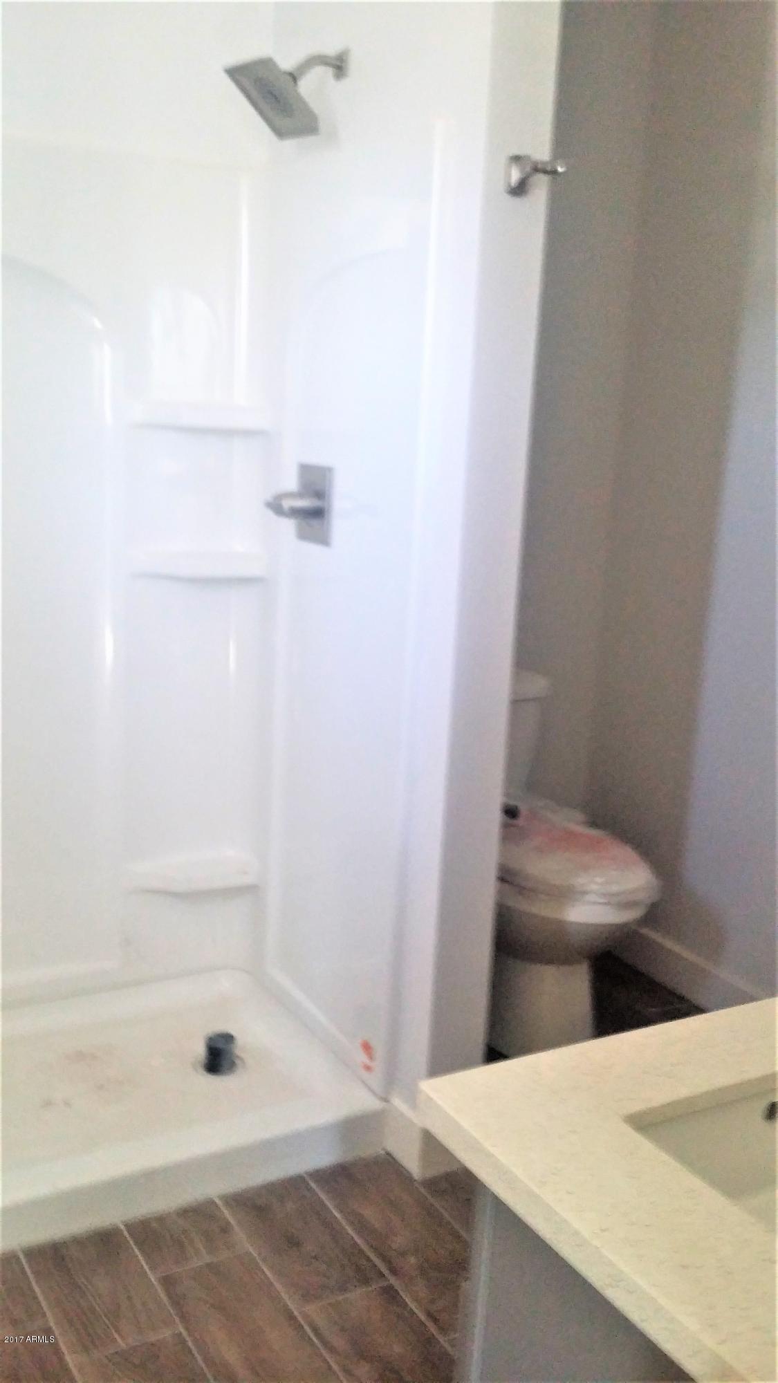 1341 East Polk Street, Unit 103 Phoenix, AZ 85006 - Photo 14 of 17 Downstairs Master Walk in Shower