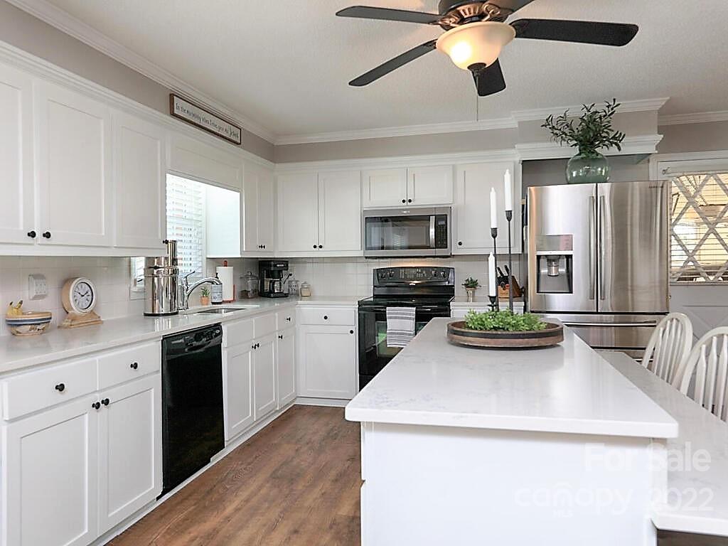 5600 Wright Road Kannapolis, NC 28081 - Photo 14 of 45 a kitchen with a sink a stove and cabinets