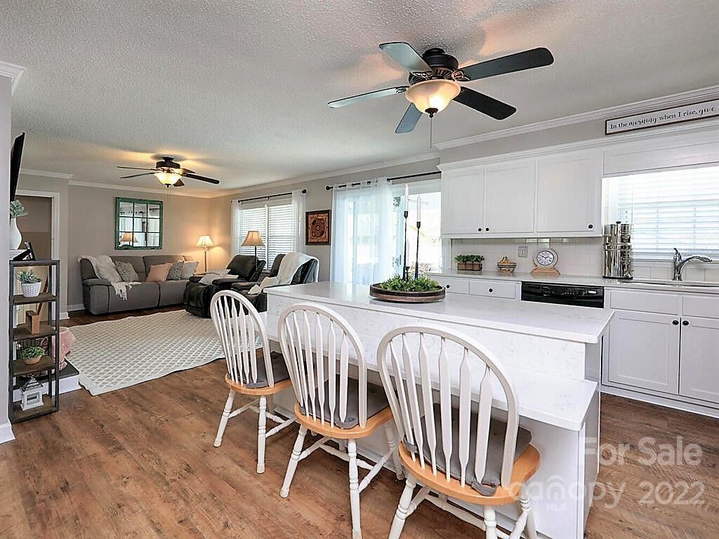 5600 Wright Road Kannapolis, NC 28081 - Photo 20 of 45 a living room with furniture a ceiling fan and a rug