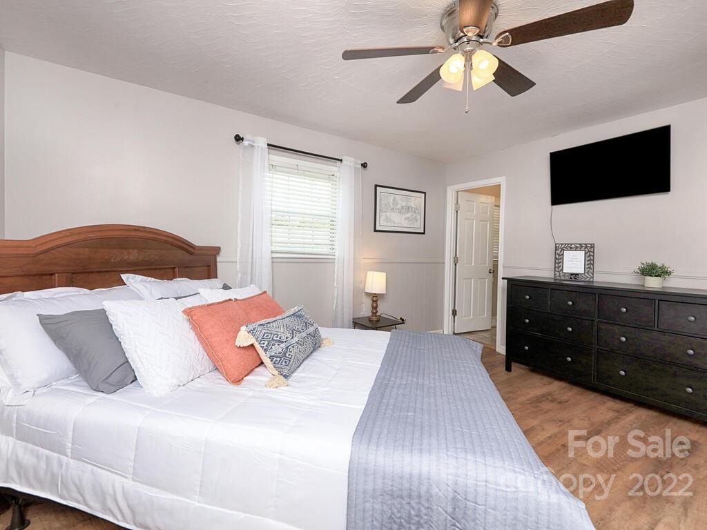 5600 Wright Road Kannapolis, NC 28081 - Photo 23 of 45 a bedroom with a bed and a flat screen tv
