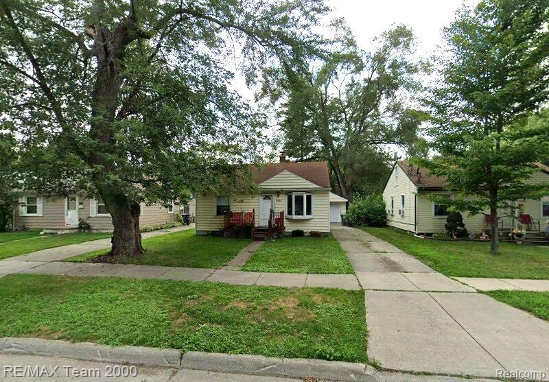 6646 Harding Street Taylor, MI 48180 - Photo 1 of 9 Single-story residence featuring light-colored siding, a covered front entry, and a paved driveway