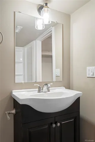 a sink and table with wooden floor