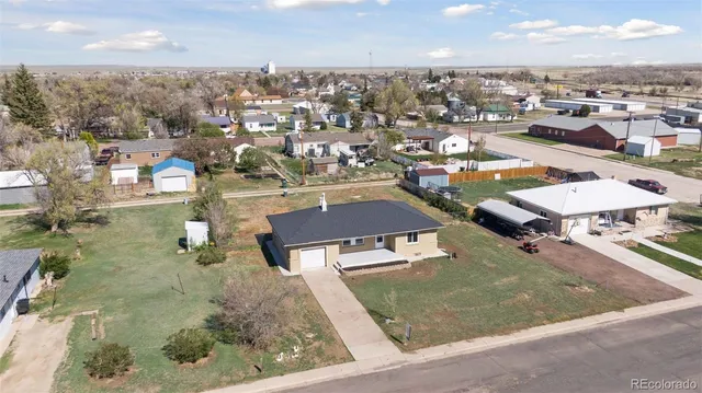 an aerial view of a residential houses with outdoor space
