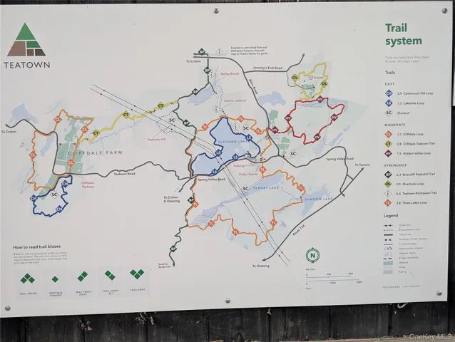 a view of a street with a building in the background