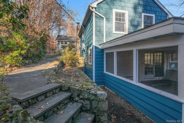 a view of a backyard with large trees