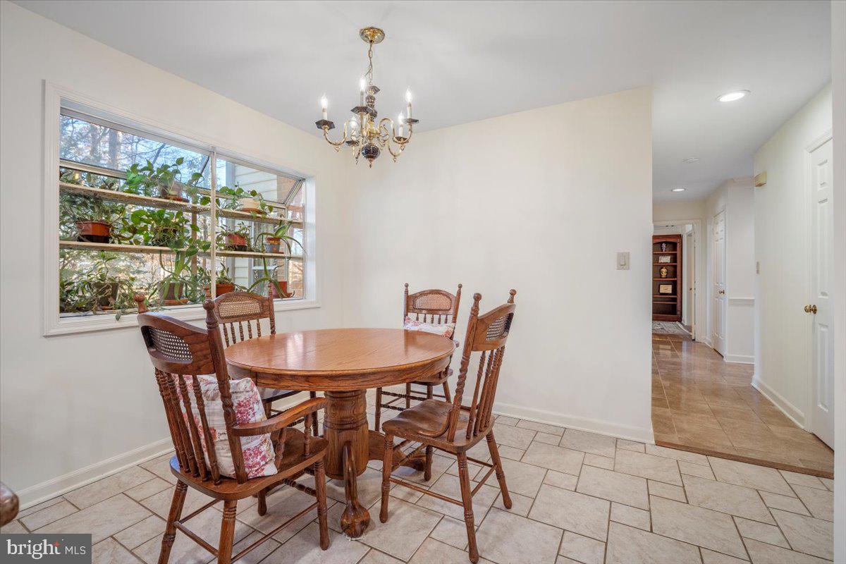 2 Candlelight Court Potomac, MD 20854 - Photo 13 of 58 a view of a dining room with furniture window and outside view