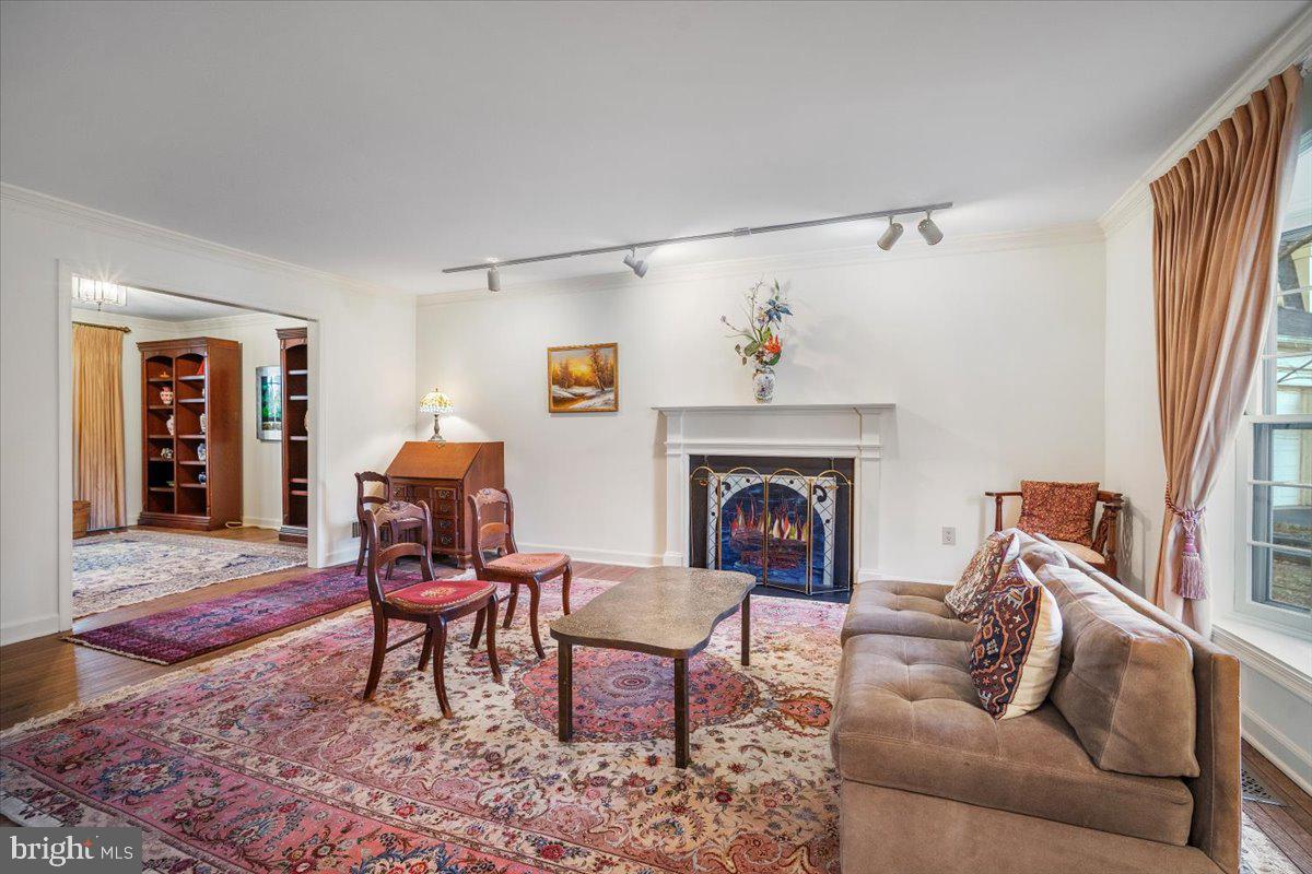 2 Candlelight Court Potomac, MD 20854 - Photo 20 of 58 a living room with furniture and a fireplace