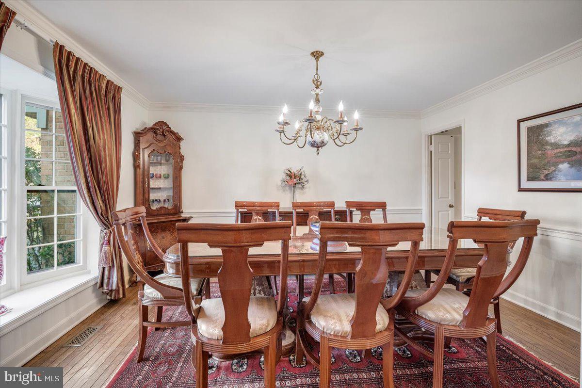 2 Candlelight Court Potomac, MD 20854 - Photo 22 of 58 a view of a dining room with furniture window and wooden floor