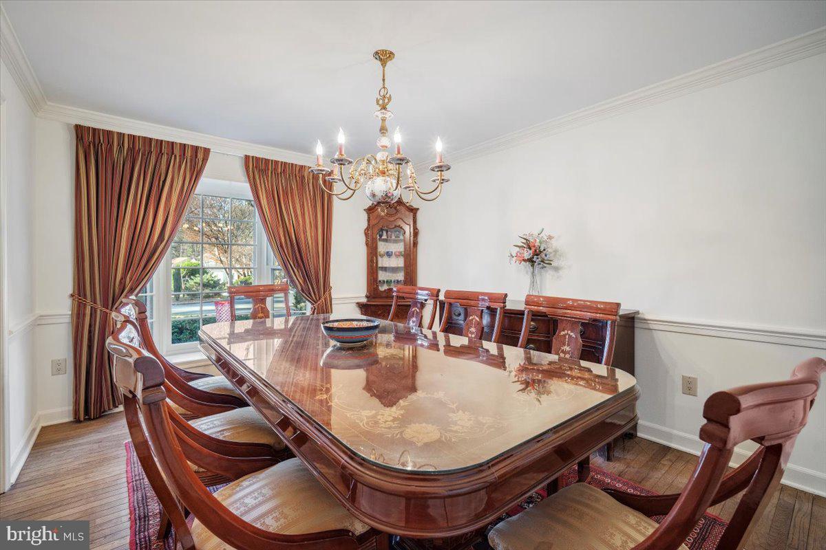 2 Candlelight Court Potomac, MD 20854 - Photo 24 of 58 a dining room with furniture a chandelier and window