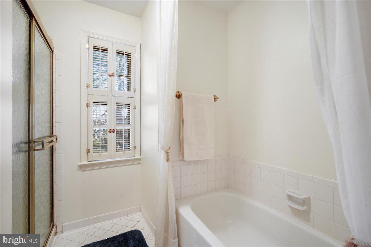 2 Candlelight Court Potomac, MD 20854 - Photo 31 of 58 a white bath tub sitting next to a shower