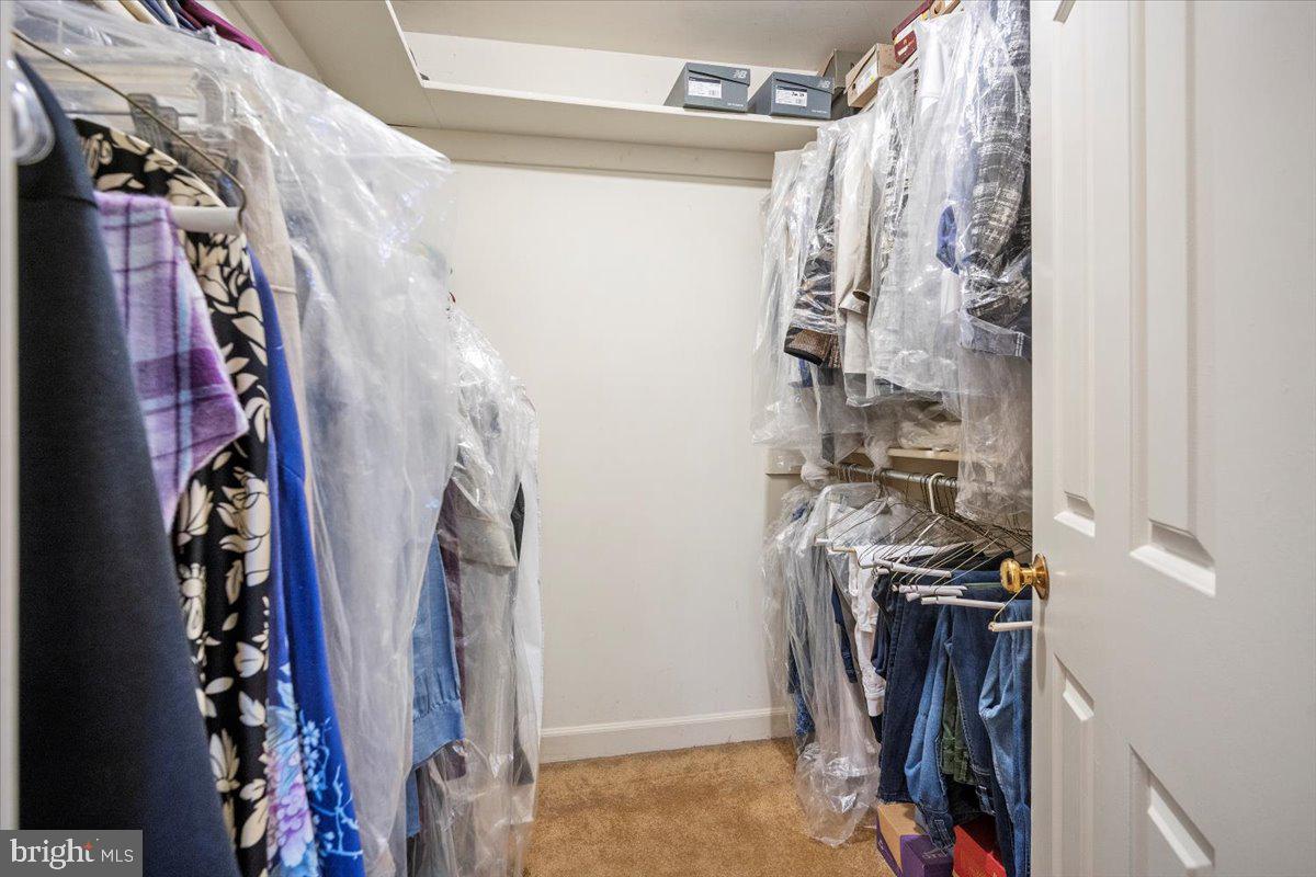 2 Candlelight Court Potomac, MD 20854 - Photo 33 of 58 a view of walk in closet with clothes