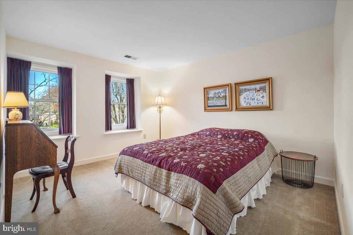 2 Candlelight Court Potomac, MD 20854 - Photo 37 of 58 a bedroom with a bed and chair