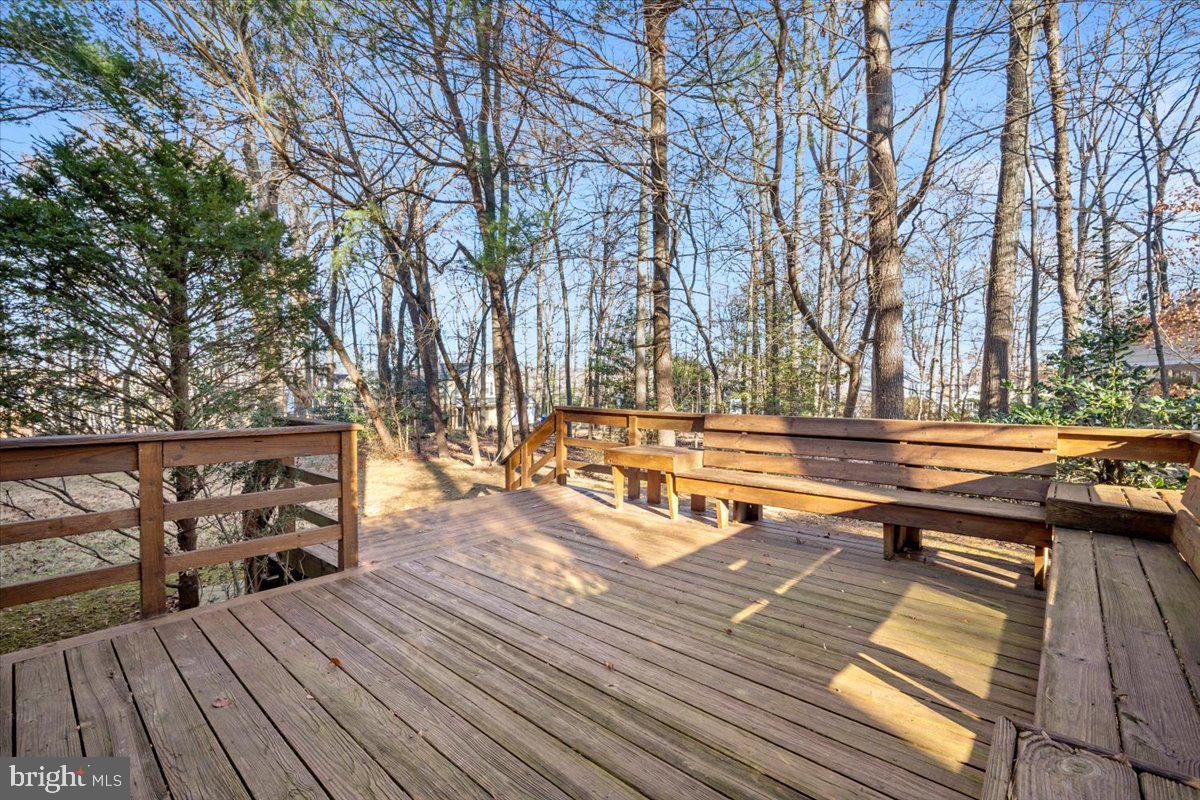 2 Candlelight Court Potomac, MD 20854 - Photo 47 of 58 a view of a wooden deck with trees
