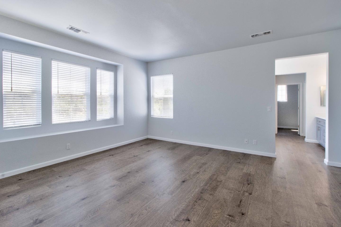 2715 Shellgate Circle Hayward, CA 94545 - Photo 23 of 47 an empty room with wooden floor and windows