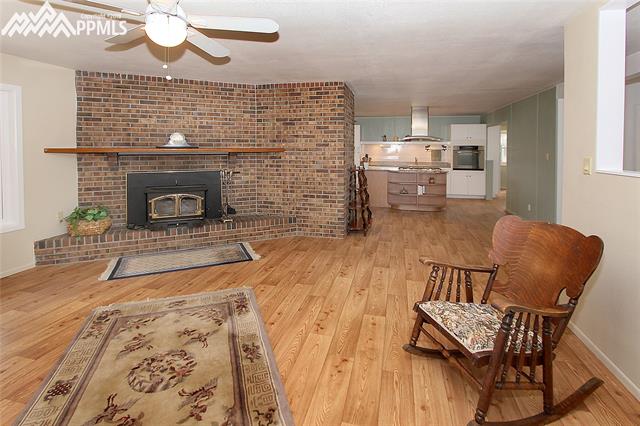 10265 Shoup Road Colorado Springs, CO 80908 - Photo 4 of 25 Family Room includes a woodburning stove
