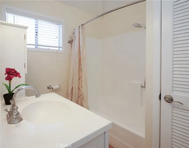 a bathroom with a sink and a shower