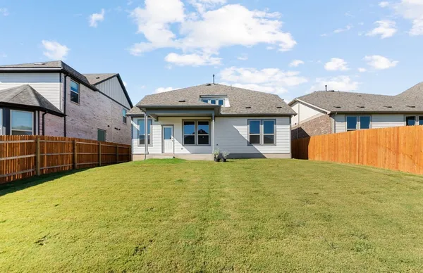 a view of a swimming pool next to a yard