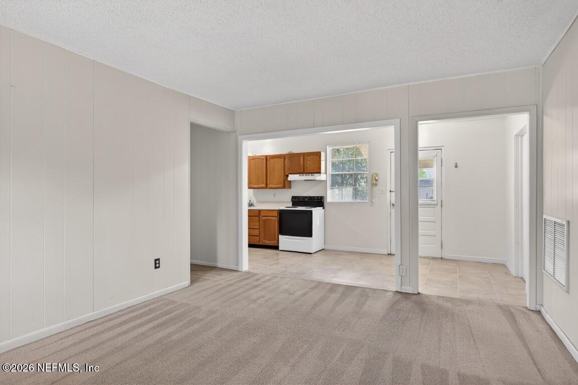 8900 Crystal Springs Road Jacksonville, FL 32221 - Photo 9 of 29 09-Living Room to Kitchen