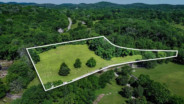 an aerial view of a golf course with a garden