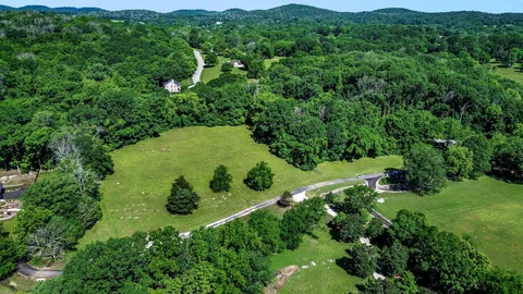 an aerial view of a lush green valley