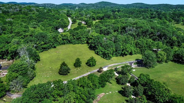 an aerial view of a lush green valley