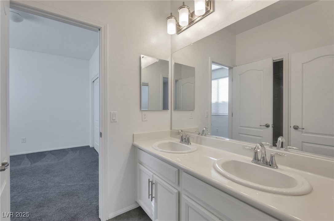 6233 Andover Wood Road Las Vegas, NV 89113 - Photo 17 of 25 jack &jill bathroom between 3rd & 4th bedrooms. Showing the 4th bedroom in this photo