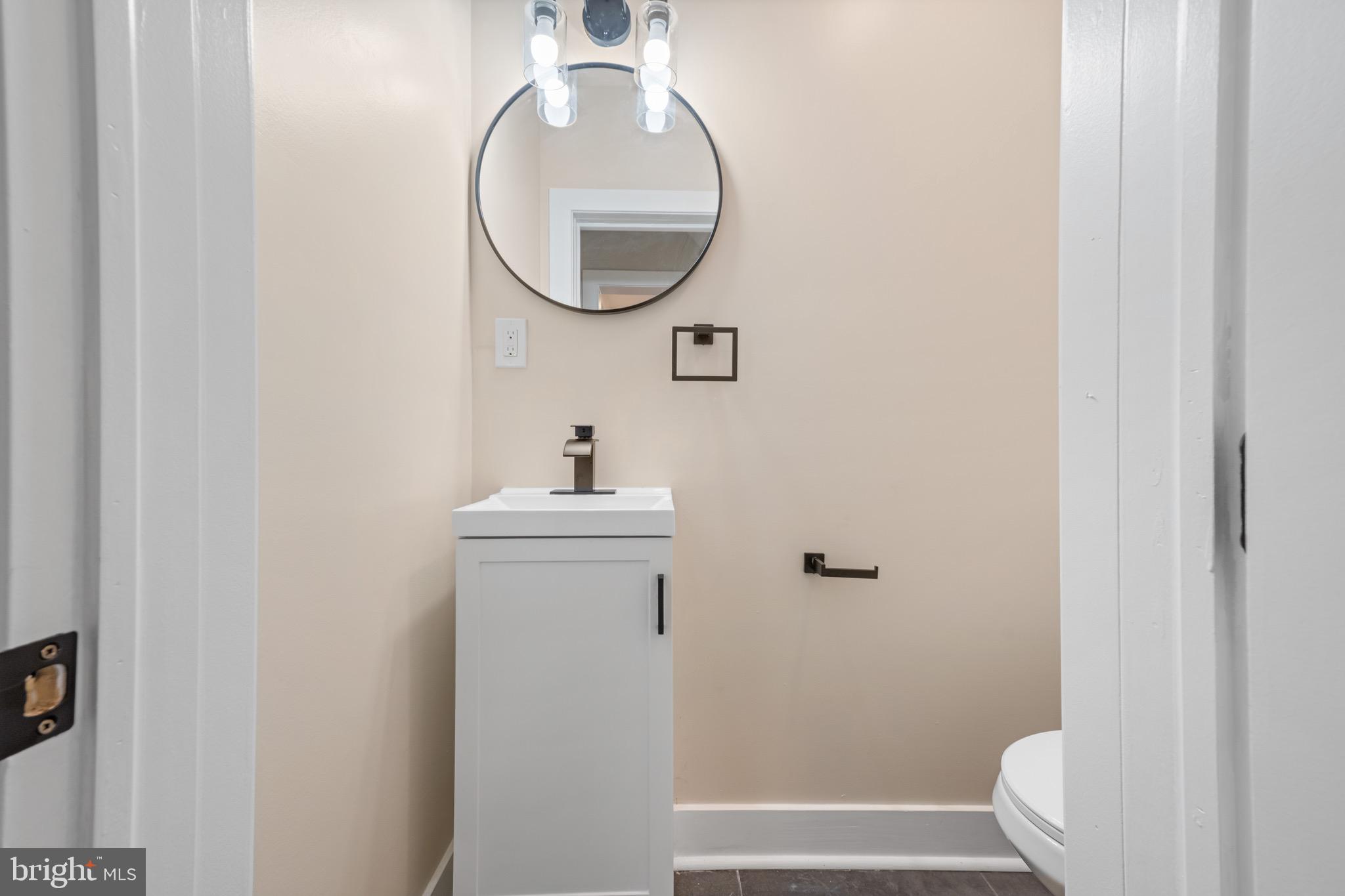 261 B Street Carneys Point, NJ 08069 - Photo 11 of 32 a bathroom with a sink and a mirror