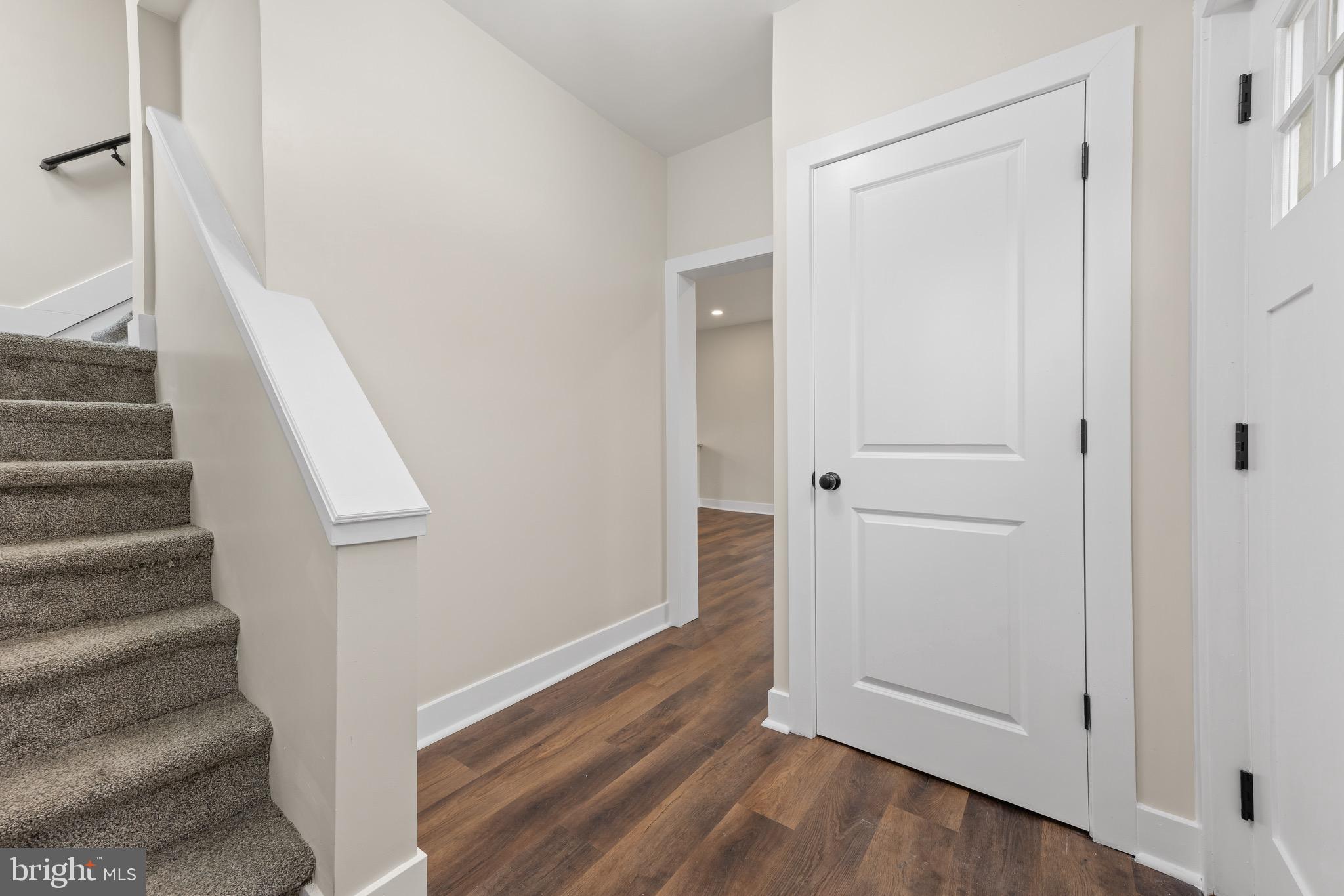 261 B Street Carneys Point, NJ 08069 - Photo 13 of 32 a view of a hallway with wooden floor and entryway