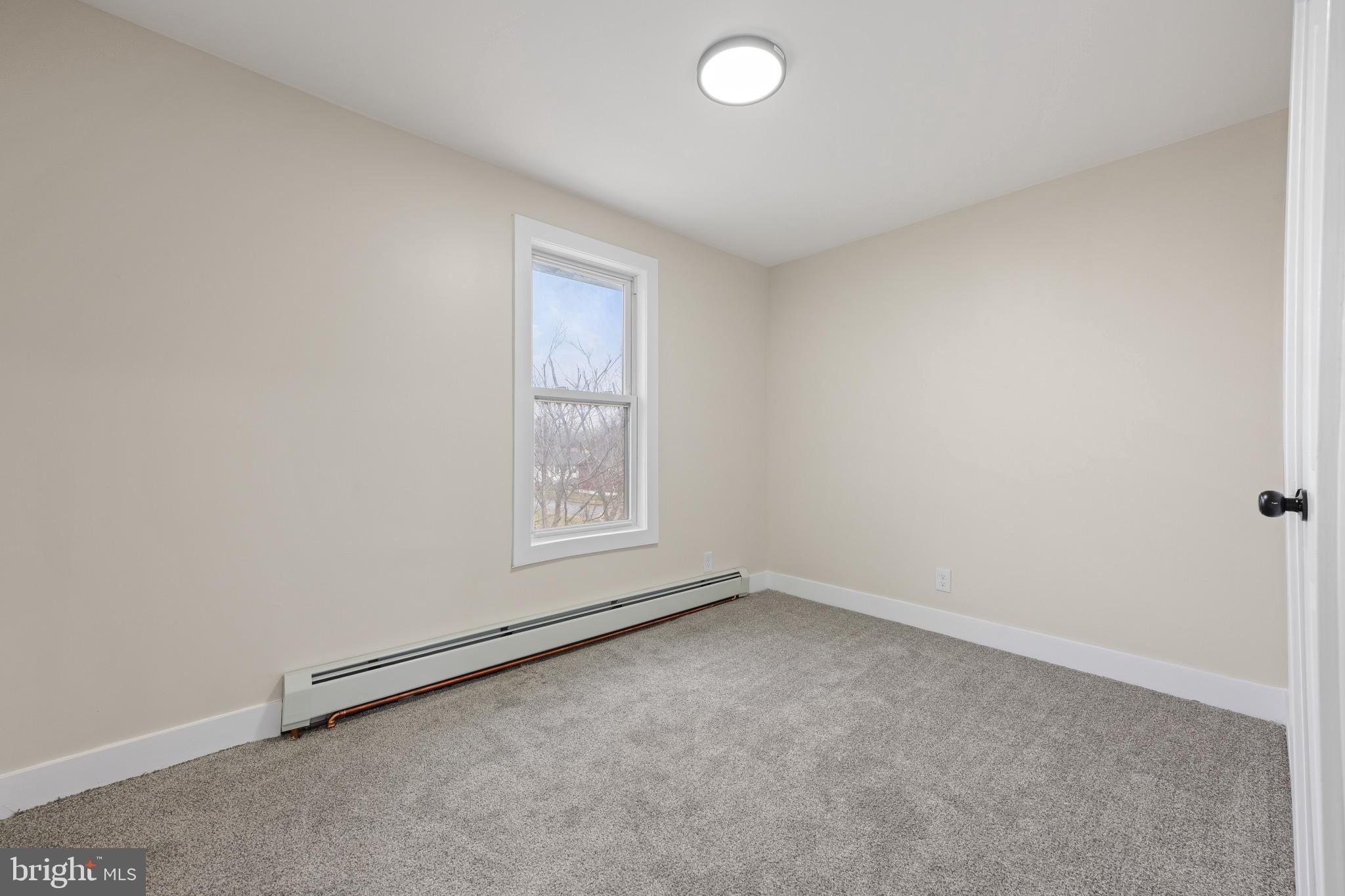 261 B Street Carneys Point, NJ 08069 - Photo 14 of 32 an empty room with a empty space and a window