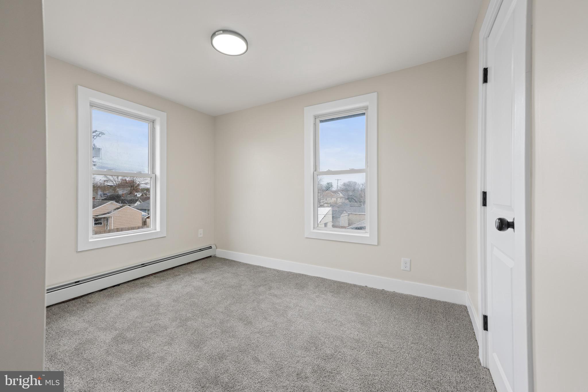 261 B Street Carneys Point, NJ 08069 - Photo 19 of 32 an empty room with windows and closet