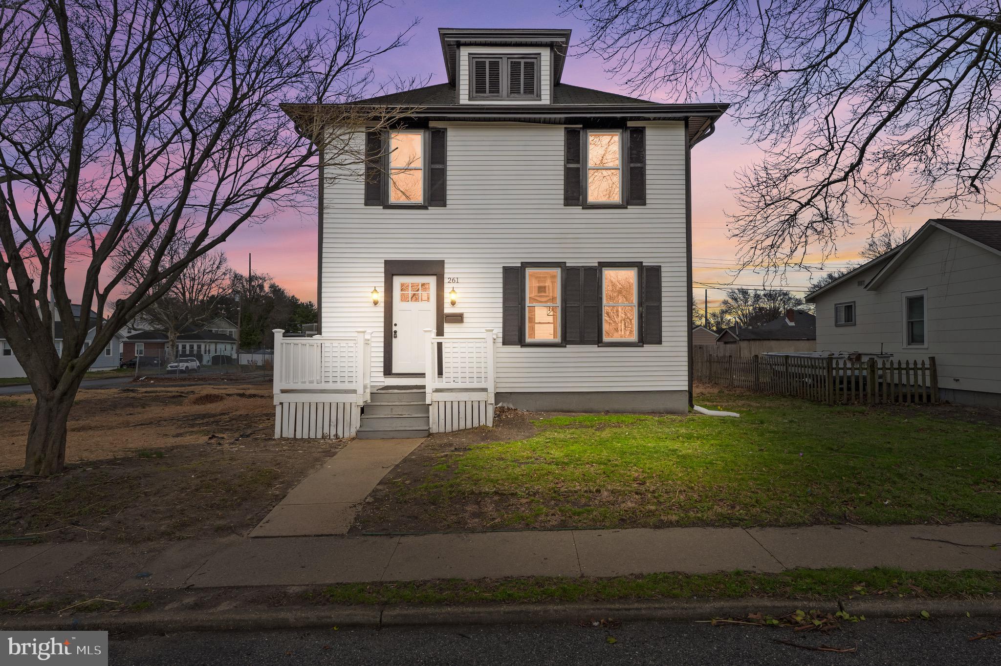 261 B Street Carneys Point, NJ 08069 - Photo 2 of 32 a front view of a house with garden