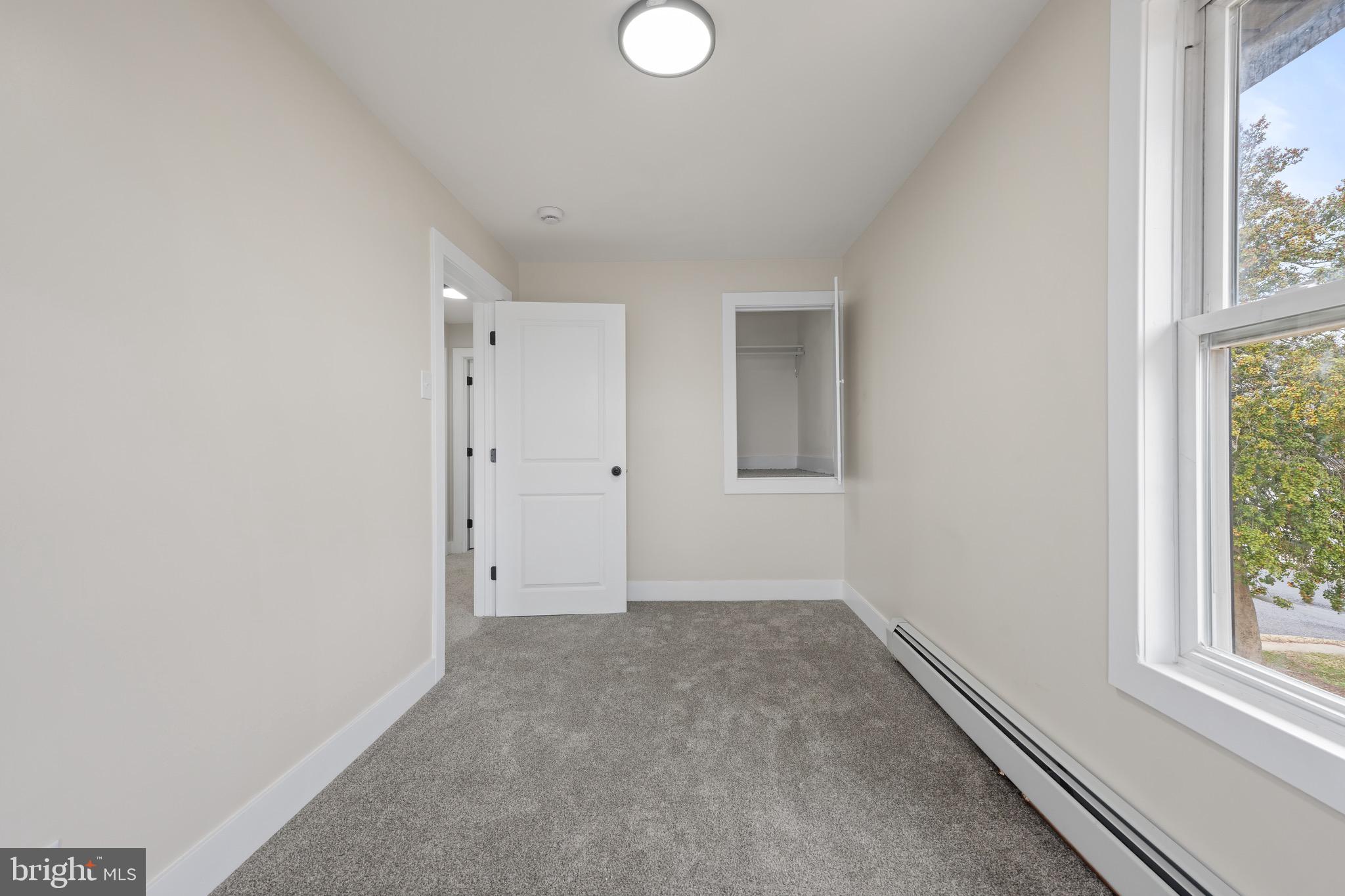 261 B Street Carneys Point, NJ 08069 - Photo 24 of 32 an empty room with windows and closet