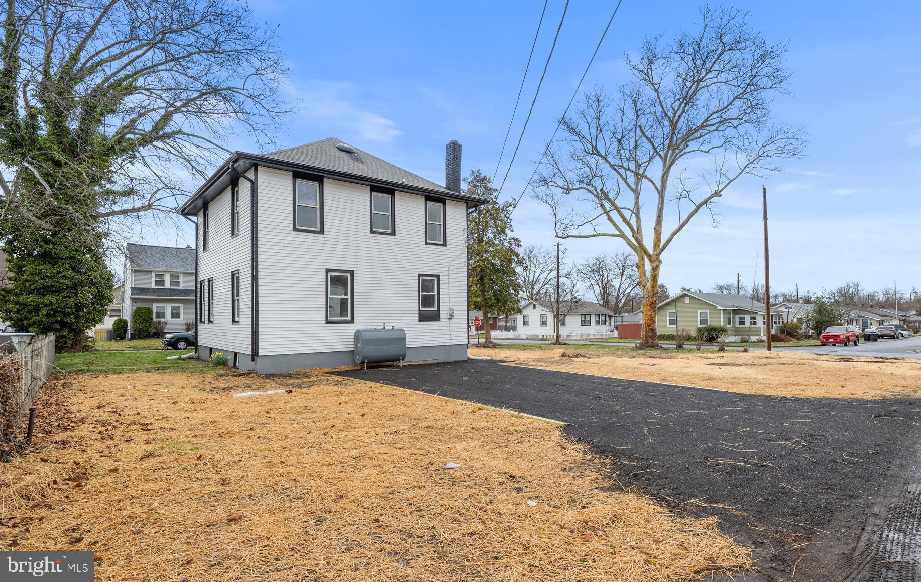 261 B Street Carneys Point, NJ 08069 - Photo 31 of 32 a view of a house with a yard and garage