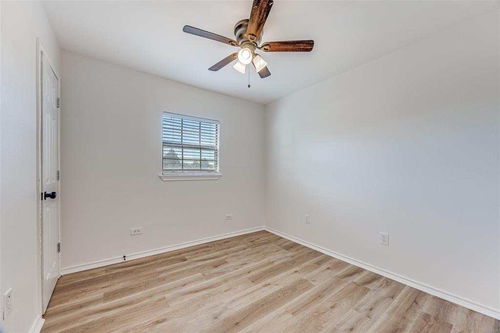 1382 Us Highway Denison, TX 75021 - Photo 15 of 25 wooden floor in an empty room with a window
