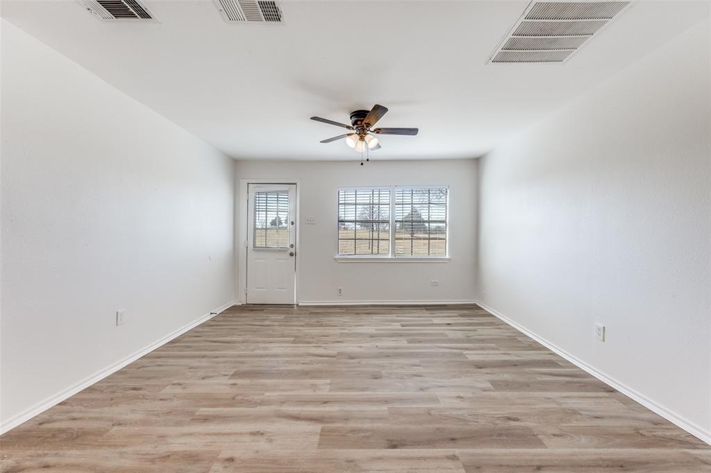 1382 Us Highway Denison, TX 75021 - Photo 20 of 25 wooden floor in an empty room with a window