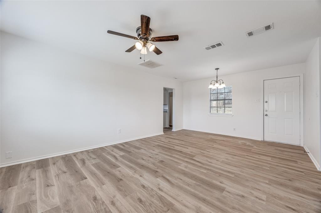 1382 Us Highway Denison, TX 75021 - Photo 2 of 25 a view of empty room with wooden floor and window