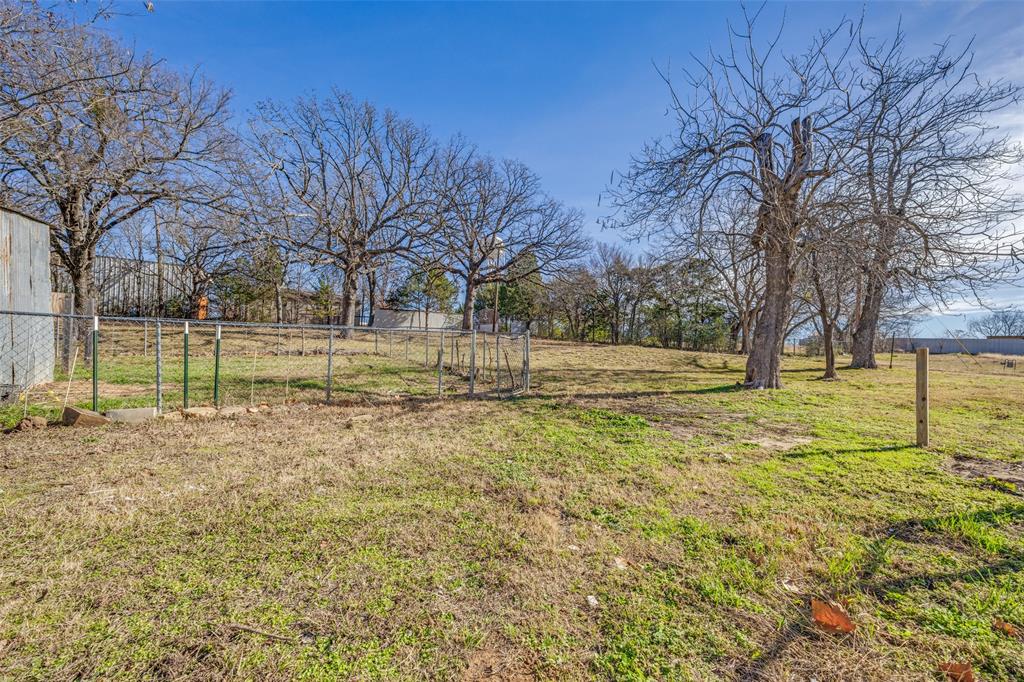1382 Us Highway Denison, TX 75021 - Photo 22 of 25 a view of yard with tree