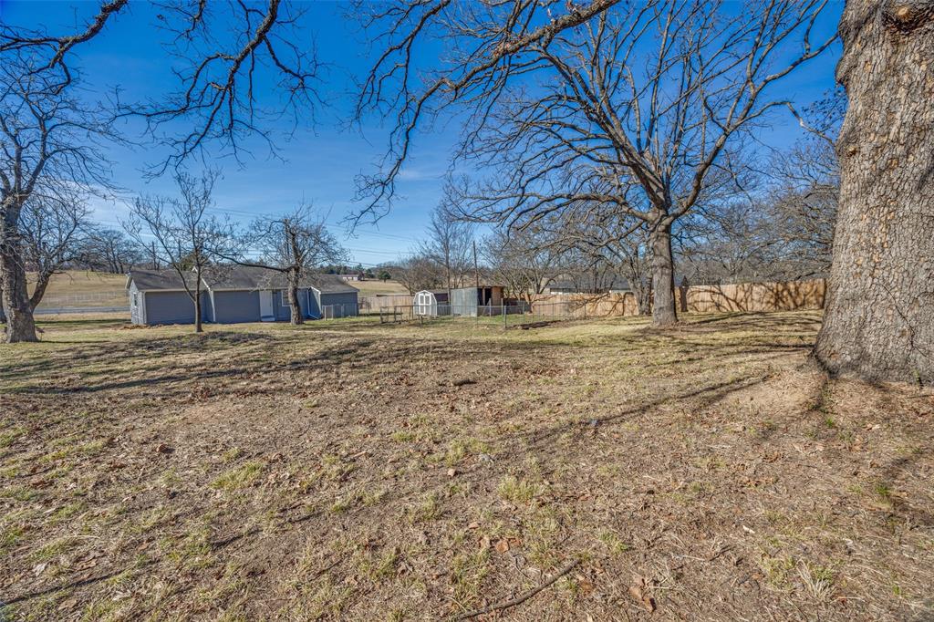 1382 Us Highway Denison, TX 75021 - Photo 24 of 25 a view of a yard with snow on the wall