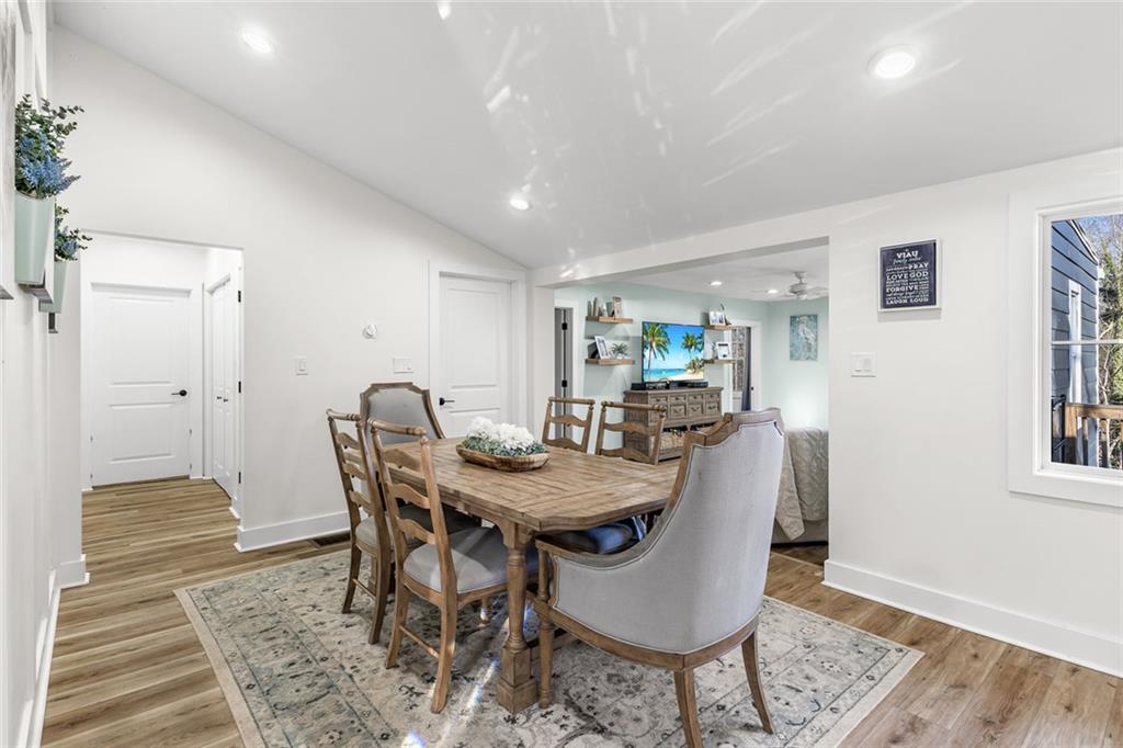 6120 Cardinal Drive Gainesville, GA 30506 - Photo 17 of 34 a view of a dining room with furniture and wooden floor