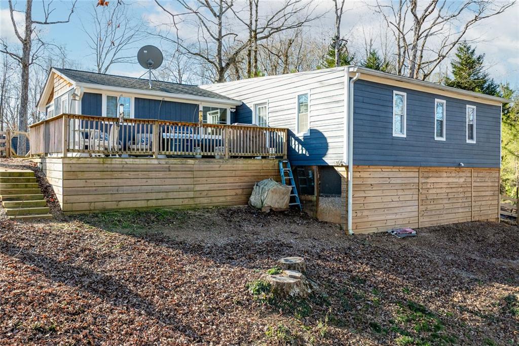 6120 Cardinal Drive Gainesville, GA 30506 - Photo 7 of 34 a view of a house with a yard