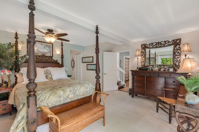 a bedroom with furniture and a bed